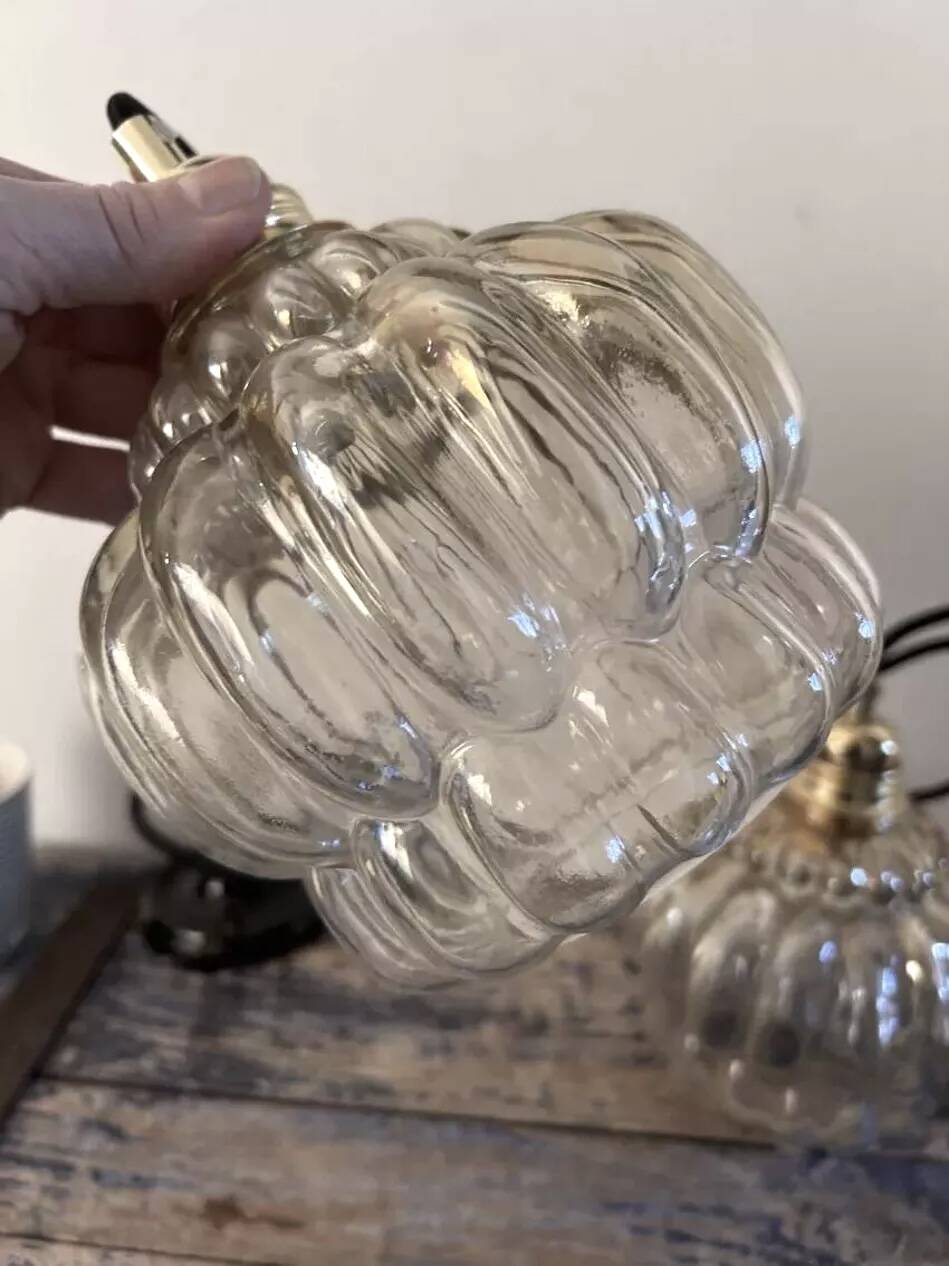 Set of two amber glass pendant lights