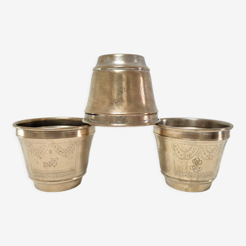Three pot covers brass silver cover golden patina monogram early twentieth century