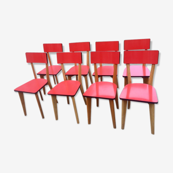 Eight wooden and formica chairs