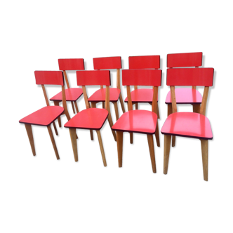 Eight wooden and formica chairs