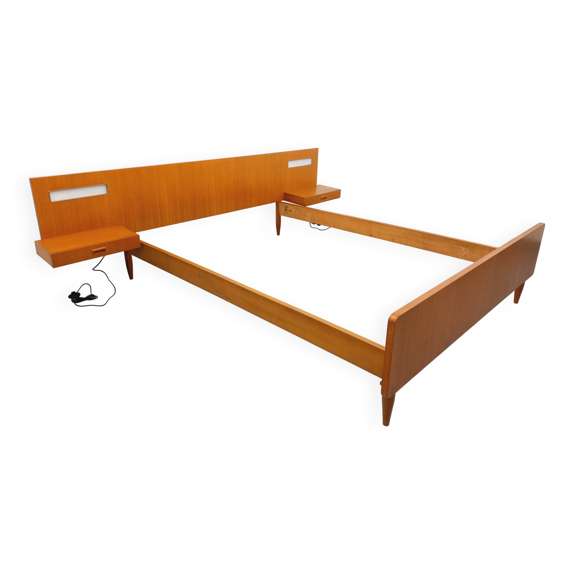 Double bed in vintage Scandinavian style from the 1960s with bedside tables.