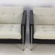 Pair of armchairs by Pierre Paulin for Artifort, black leather and cream fabric.