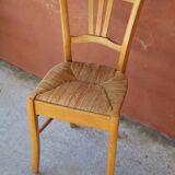 Set of 5 mismatched straw chairs.