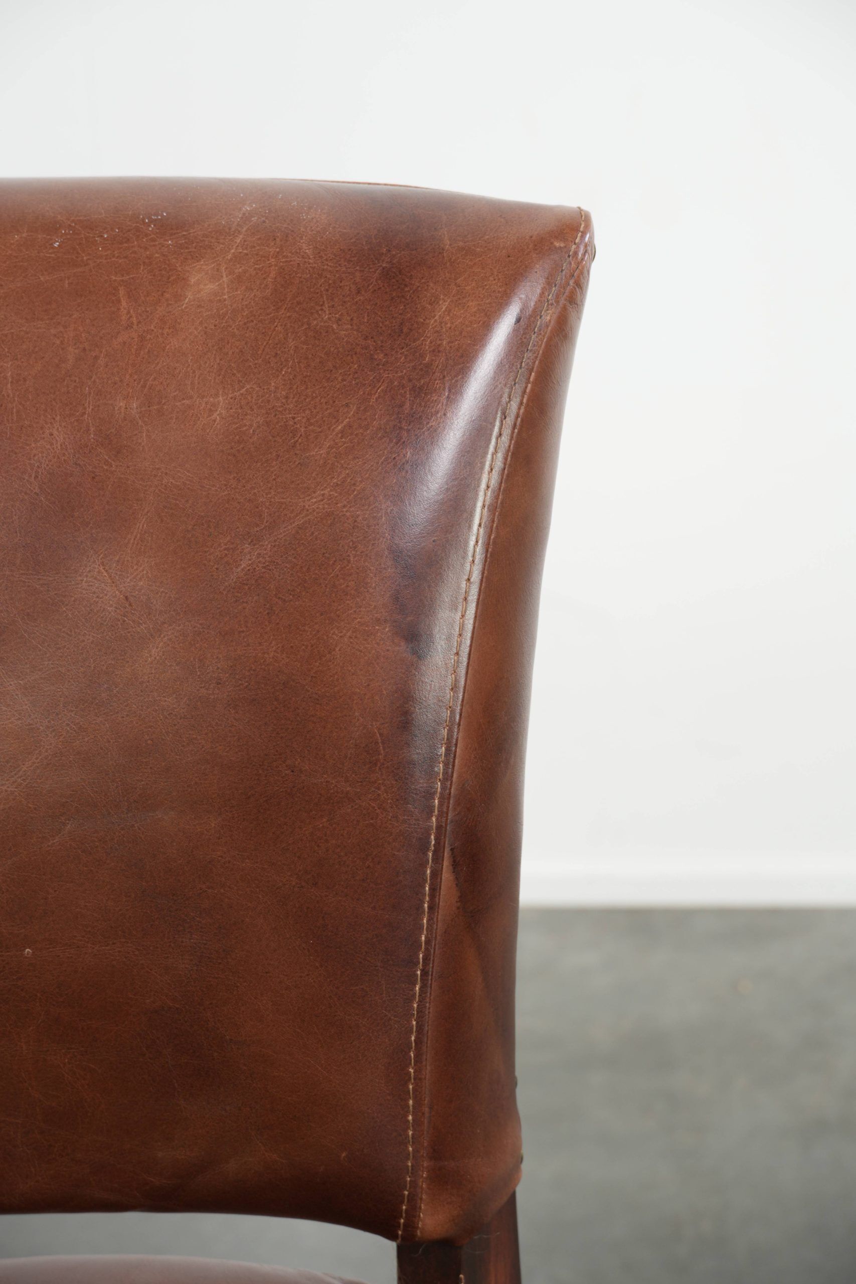 Set of 4 cognac-coloured cowleather dining chairs with decorative nails
