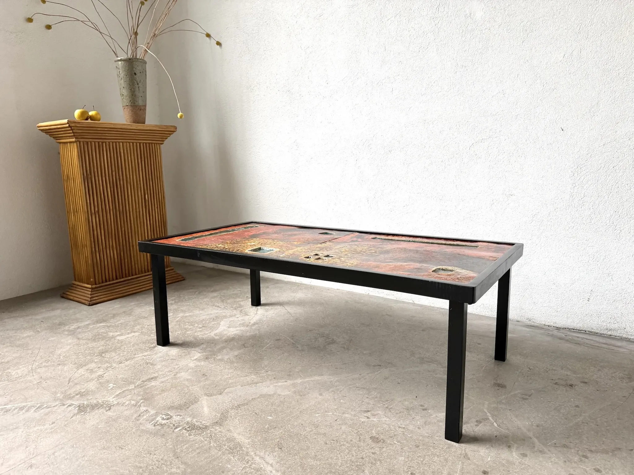 Coffee table by Robert and Jean Cloutier in enamelled lava and metal, 1950s.