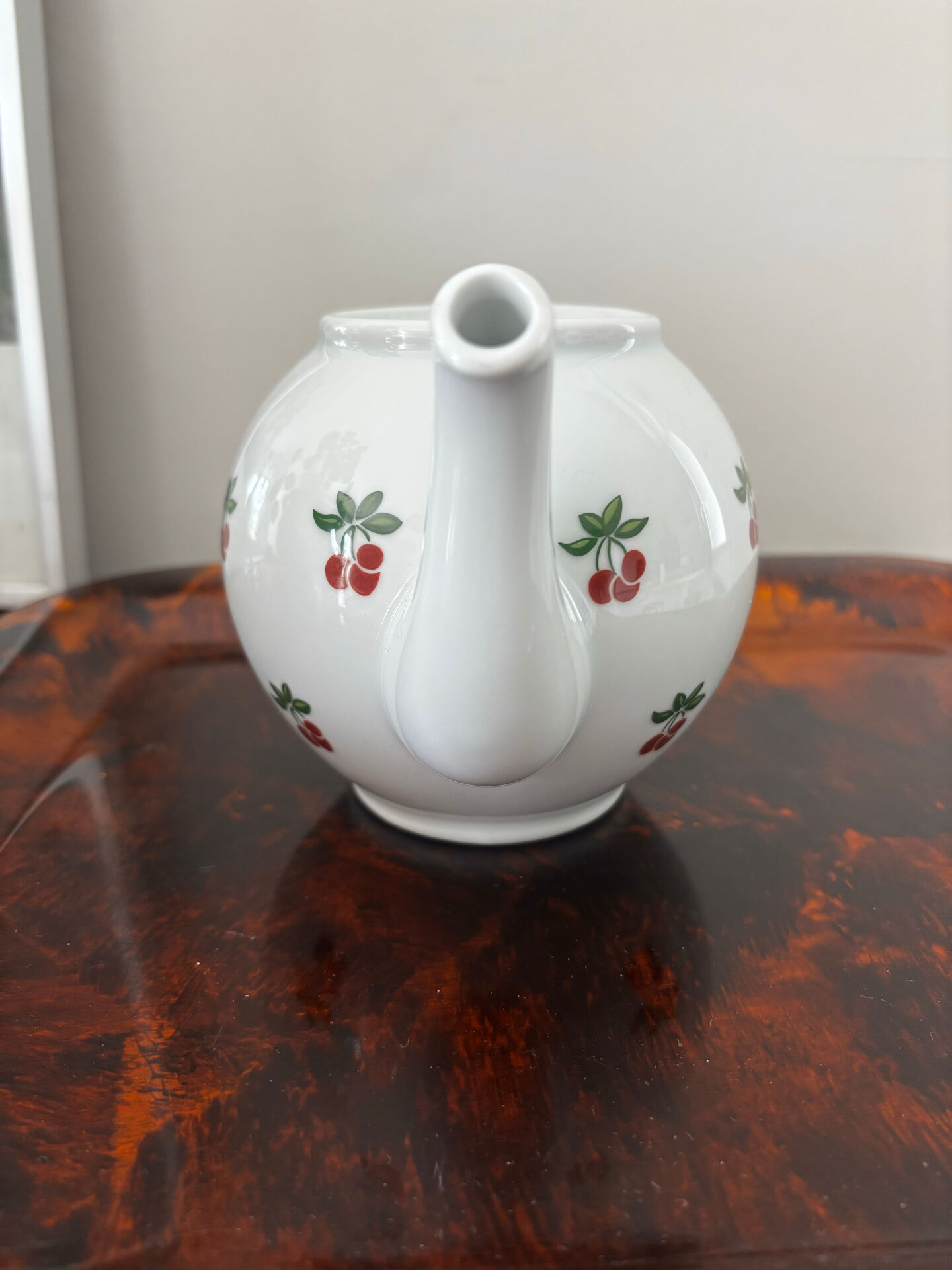 Magnificent teapot and fine porcelain cup set by Pillivuyt with cherries.