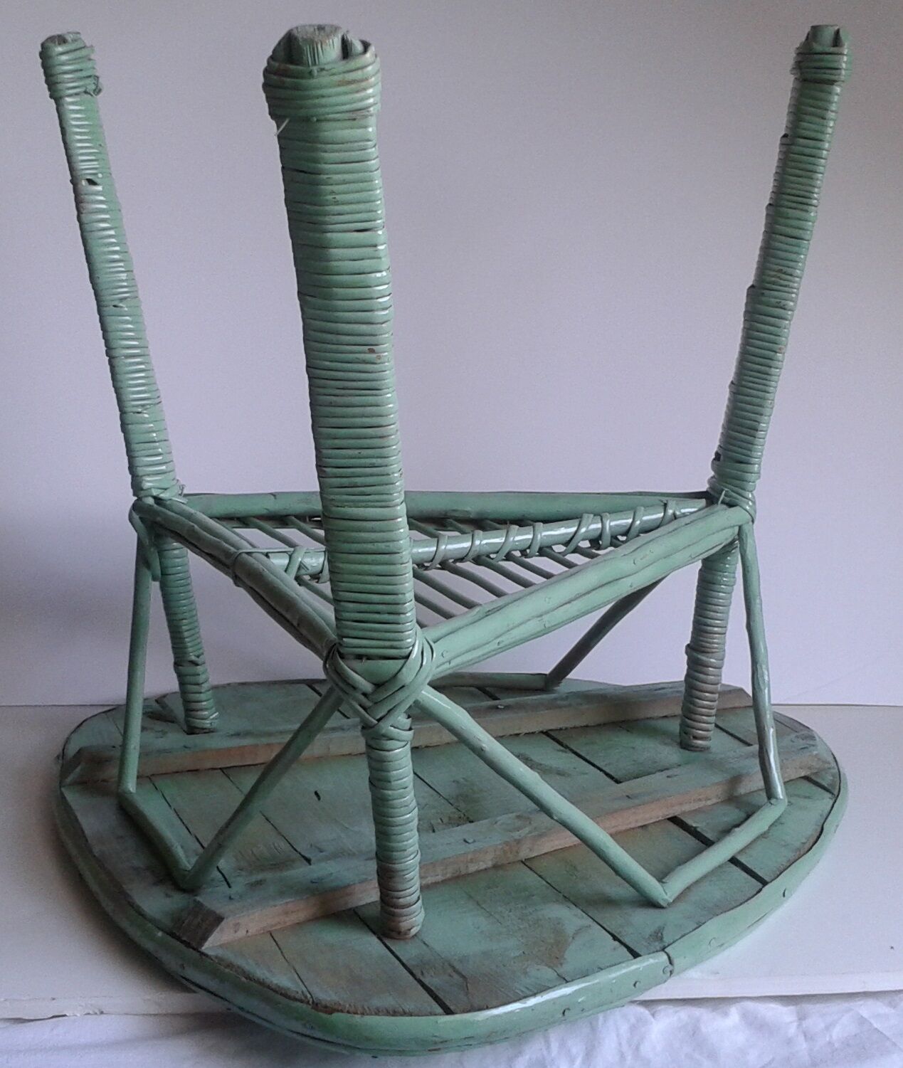 Triangular wooden and braided wicker coffee table