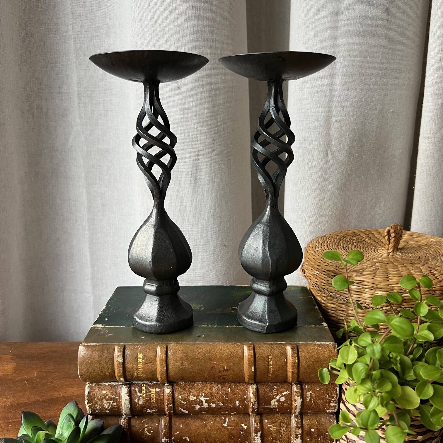 Pair of wrought iron candlesticks, black patina