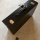 Valise cuir noir  bords et poignée piqures sellier