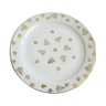 Assiette blanche et dorée vintage avec motifs de feuilles