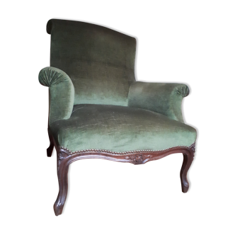 Old green velvet armchair