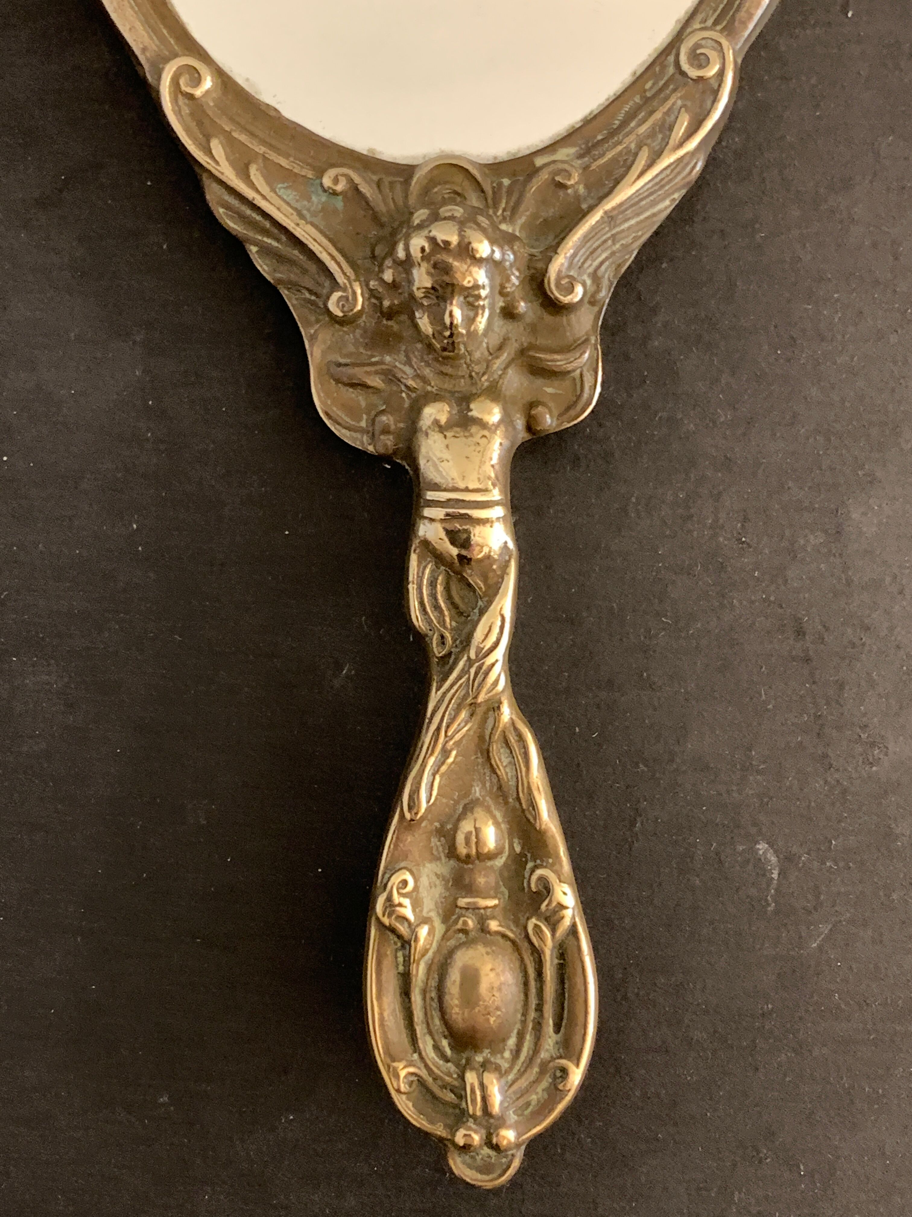Bronze hand-facing mirror, early twentieth century, Louis XV style, 29 x 13 cm