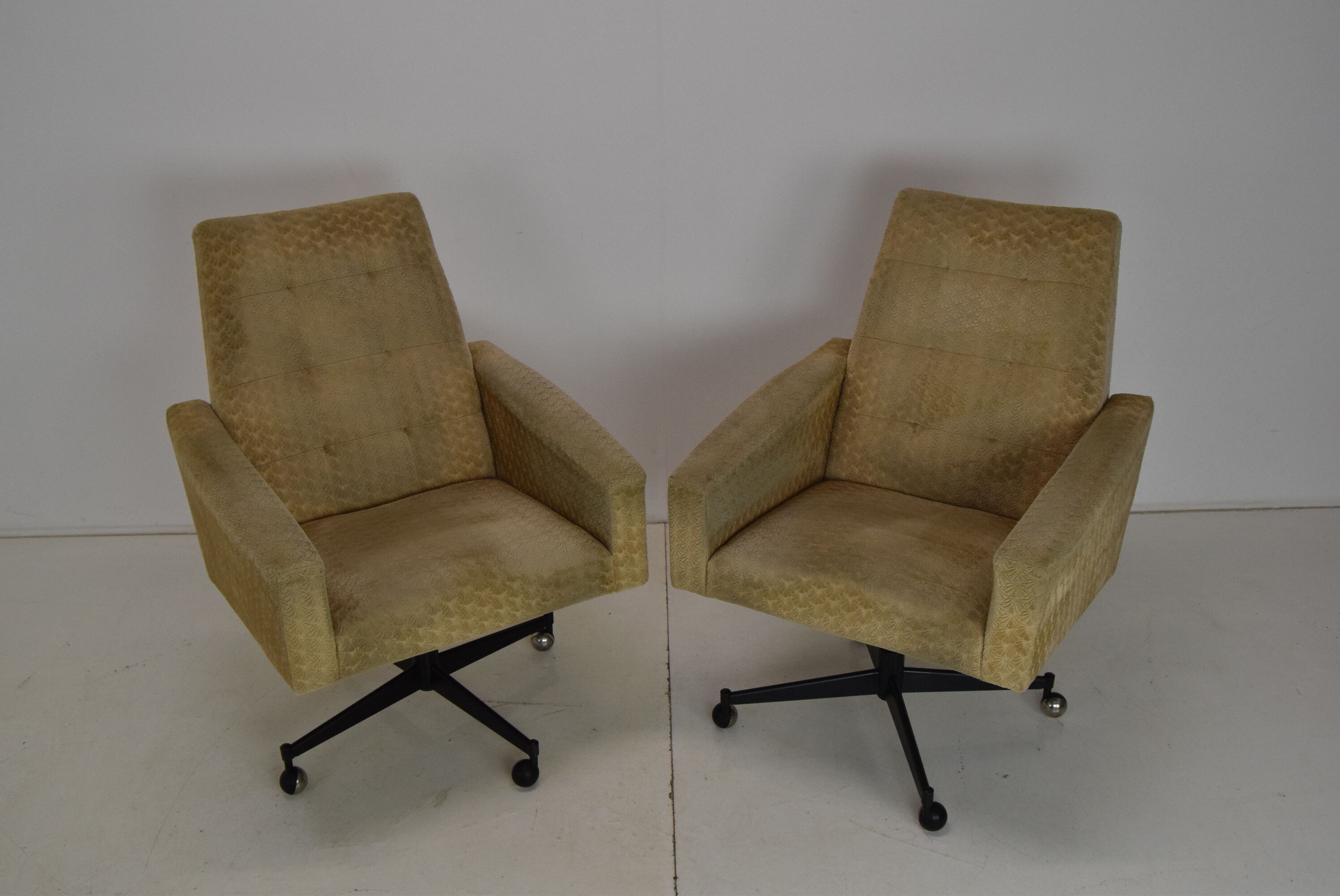 Pair of mid-century swivel armchairs with wheels 1970's