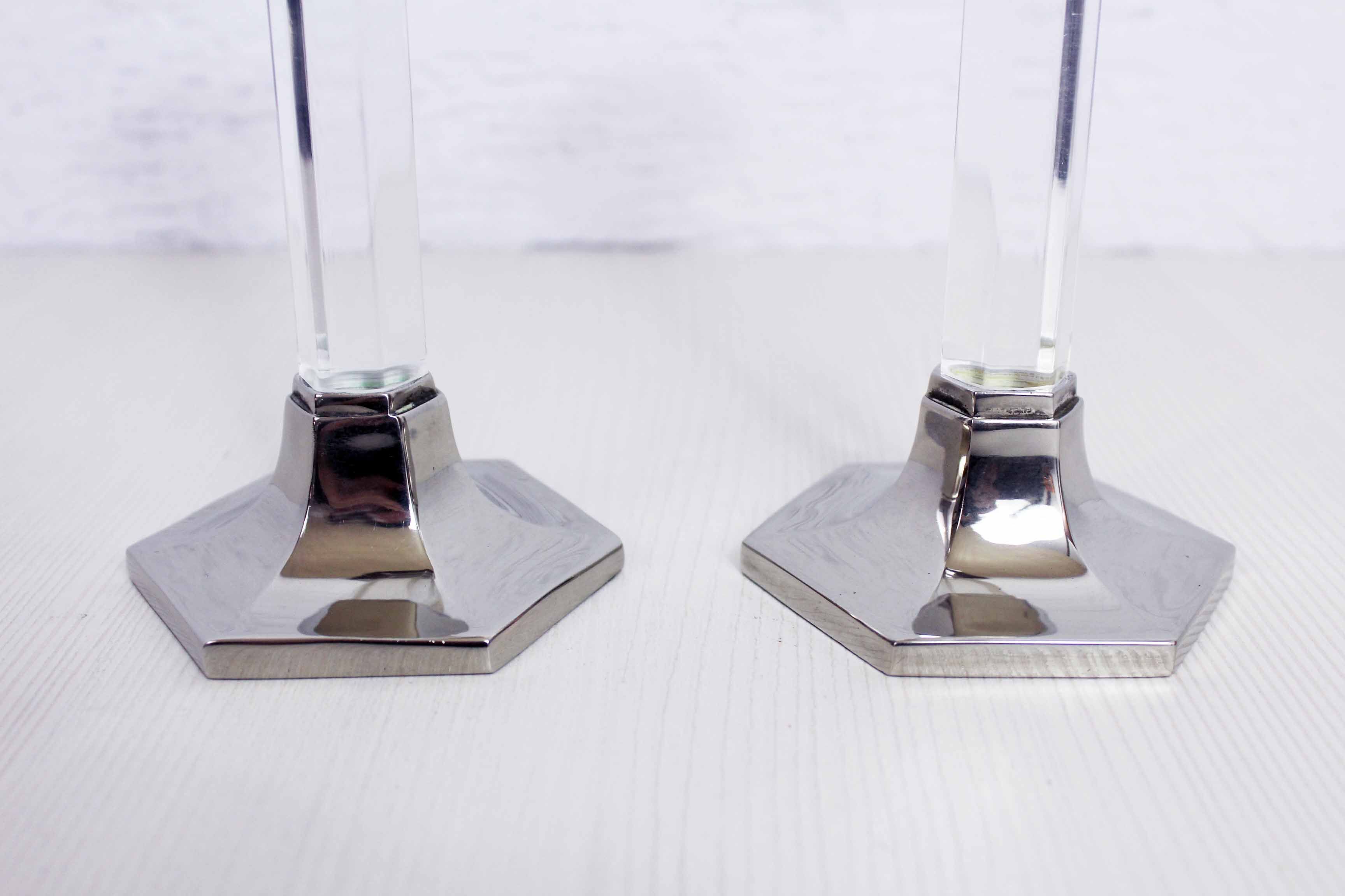 Duo of candlesticks in lucite and silver metal