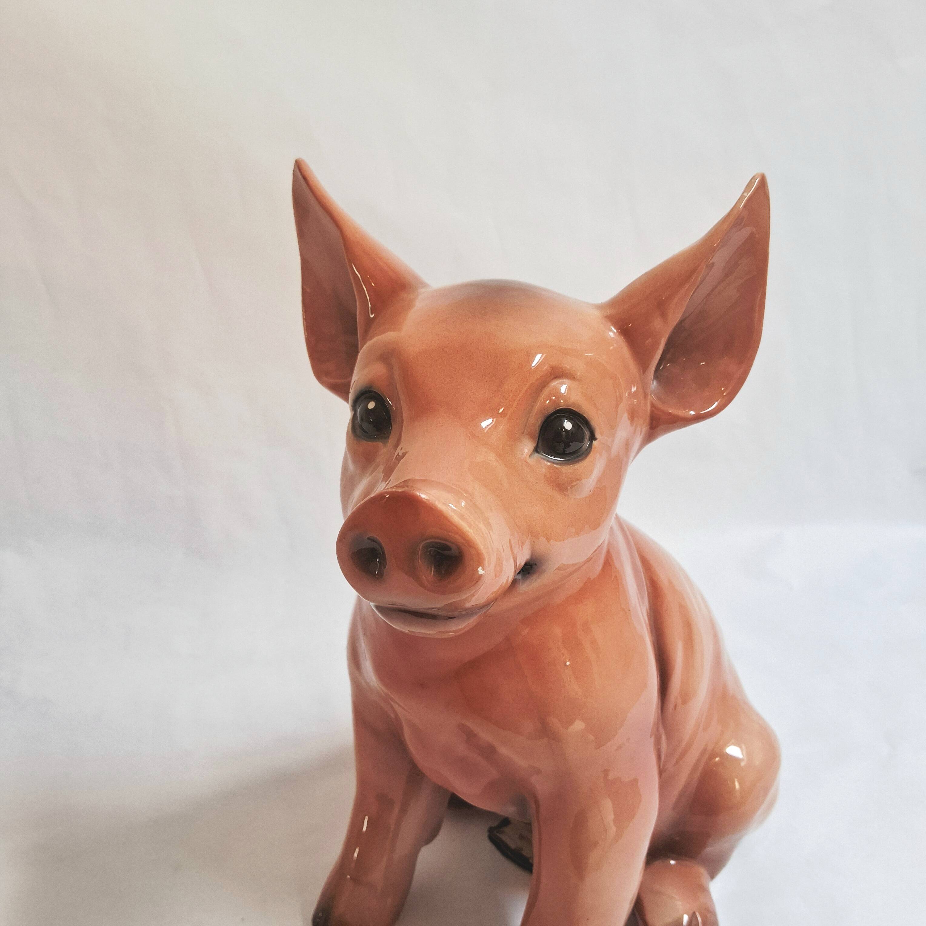 Beautiful, handcrafted porcelain figurine of a piglet, made by Capodimon.