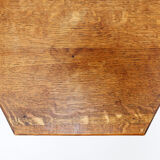 Hexagonal pedestal table or side table with a lattice structure and star pattern.