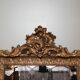 Mirror with pediment rocaille in gilded wood and stucco Louis XV style