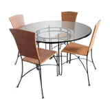 Glass and metal table and its 4 wicker chairs and glass Roche Bobois