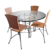 Glass and metal table and its 4 wicker chairs and glass Roche Bobois