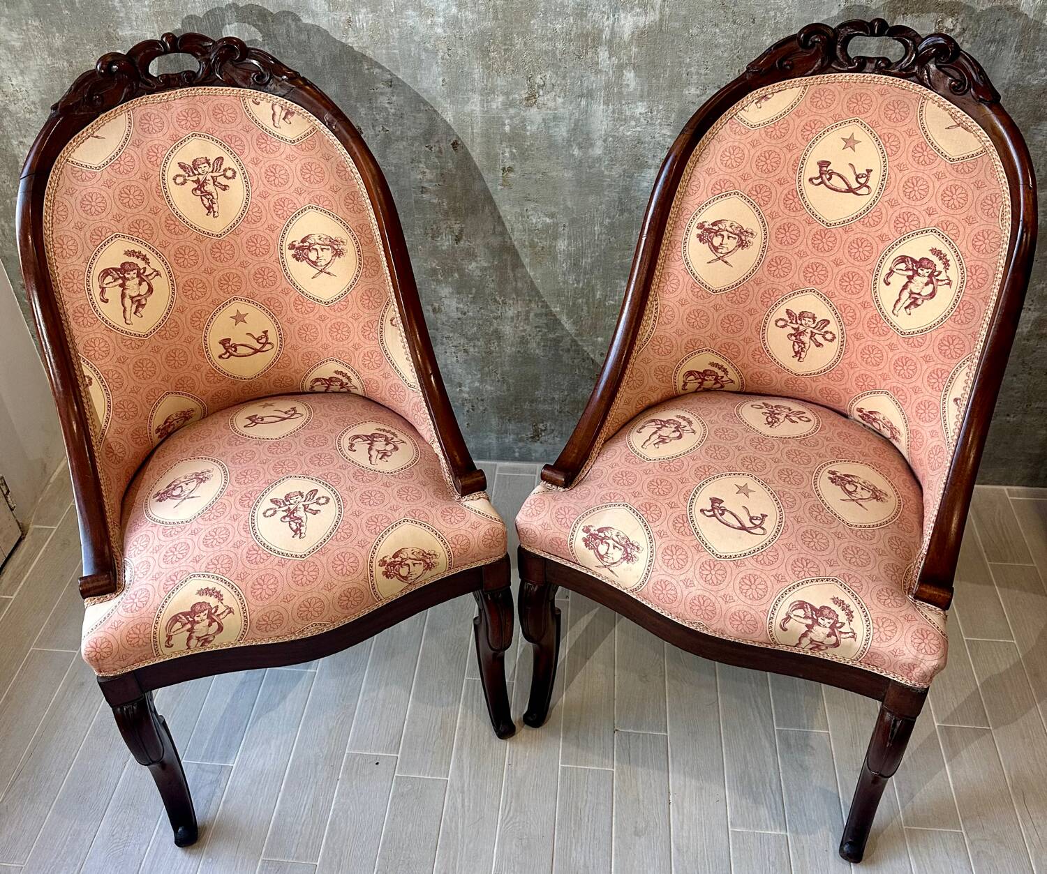 Pair of carved solid mahogany gondolas from the 19th century