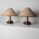Lot of 2 vintage table lamps from the 1970s, dark wood oval bases with curved brass details, handmade natural fibre lampshades, elegant lighting.