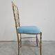 Mid-century Chiavari accent chair in solid brass with a plush seat.