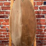 Oval mirror in a frame