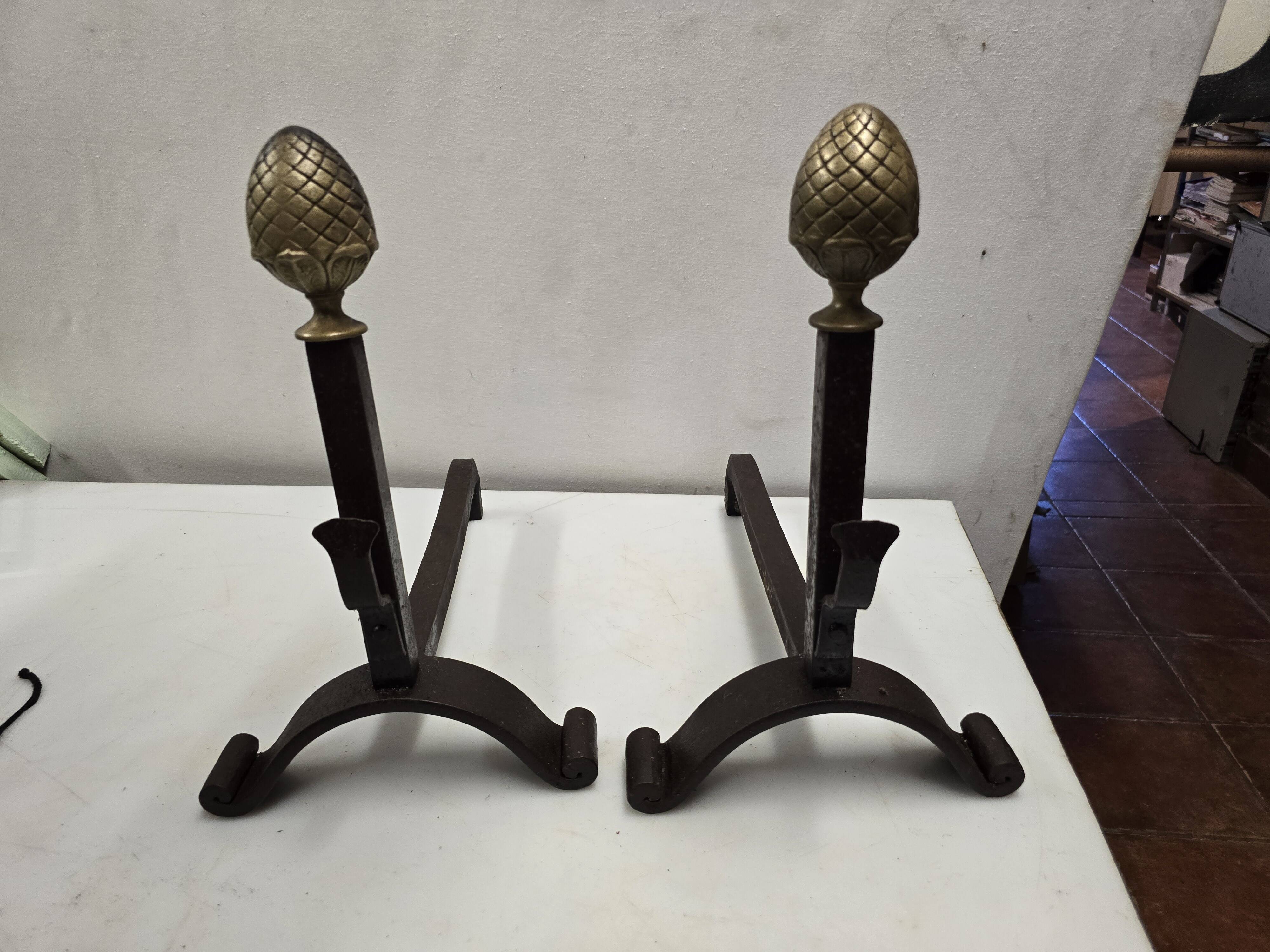 Old pair of wrought iron and bronze andirons