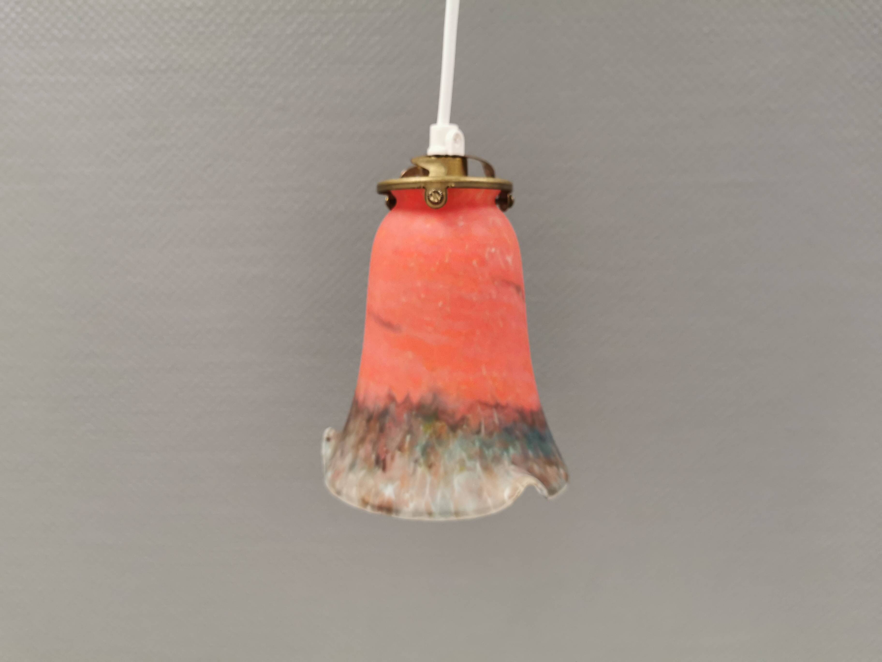 Small, beautiful hanging lamp in Art Deco style with brass top.