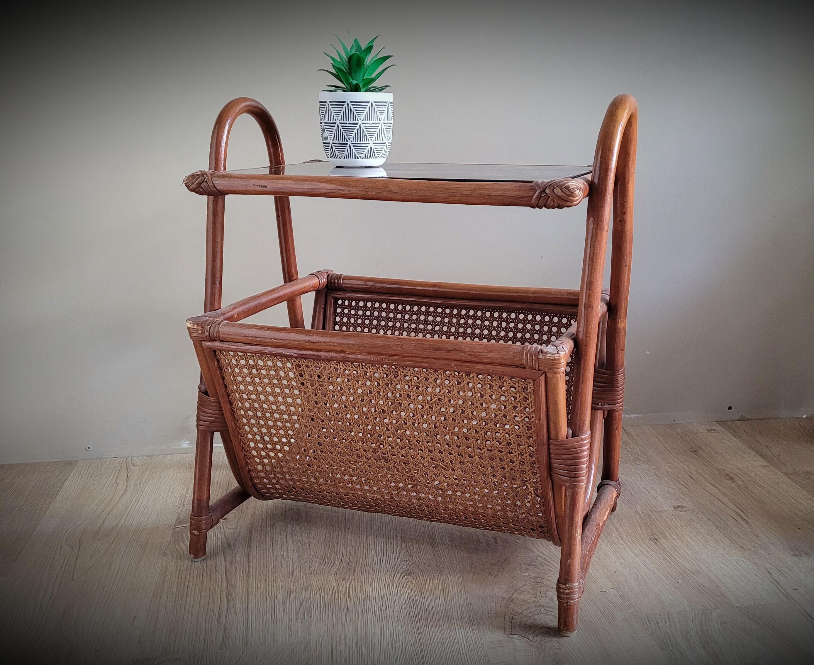 Braided rattan side table and smoked glass