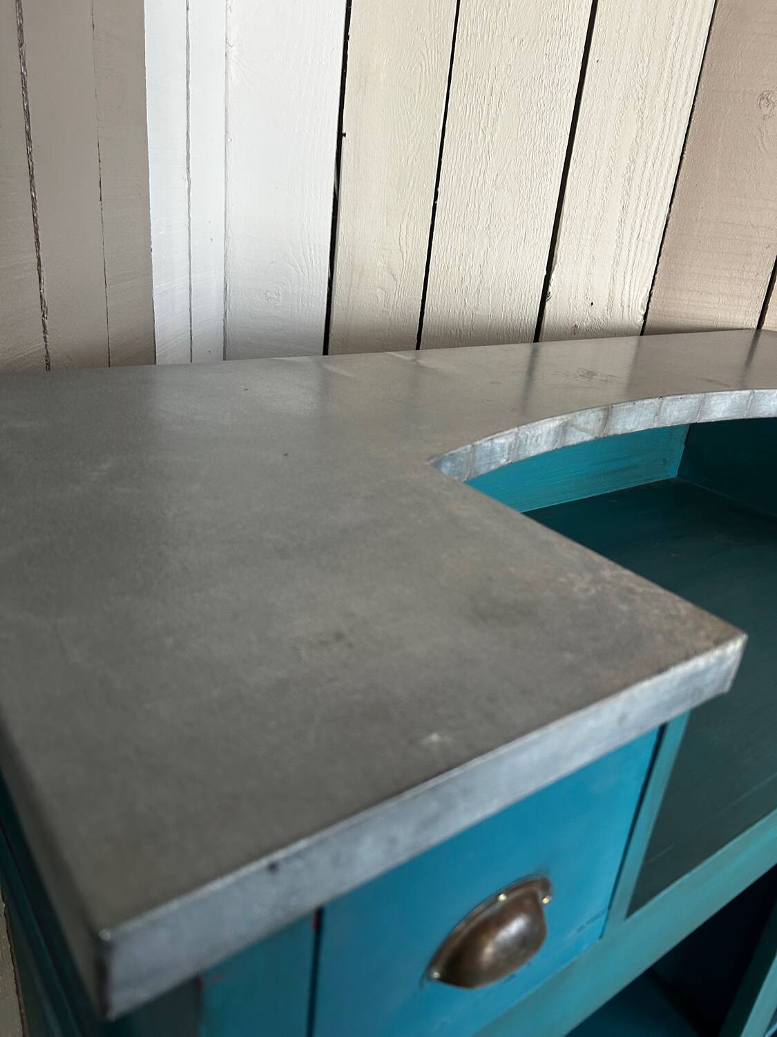 Old wooden trade counter with a zinc top.