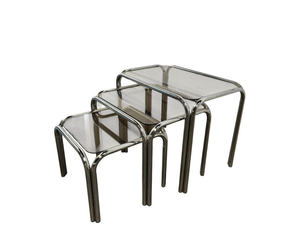 Set of 3 vintage chrome nesting tables with smoked glass.
