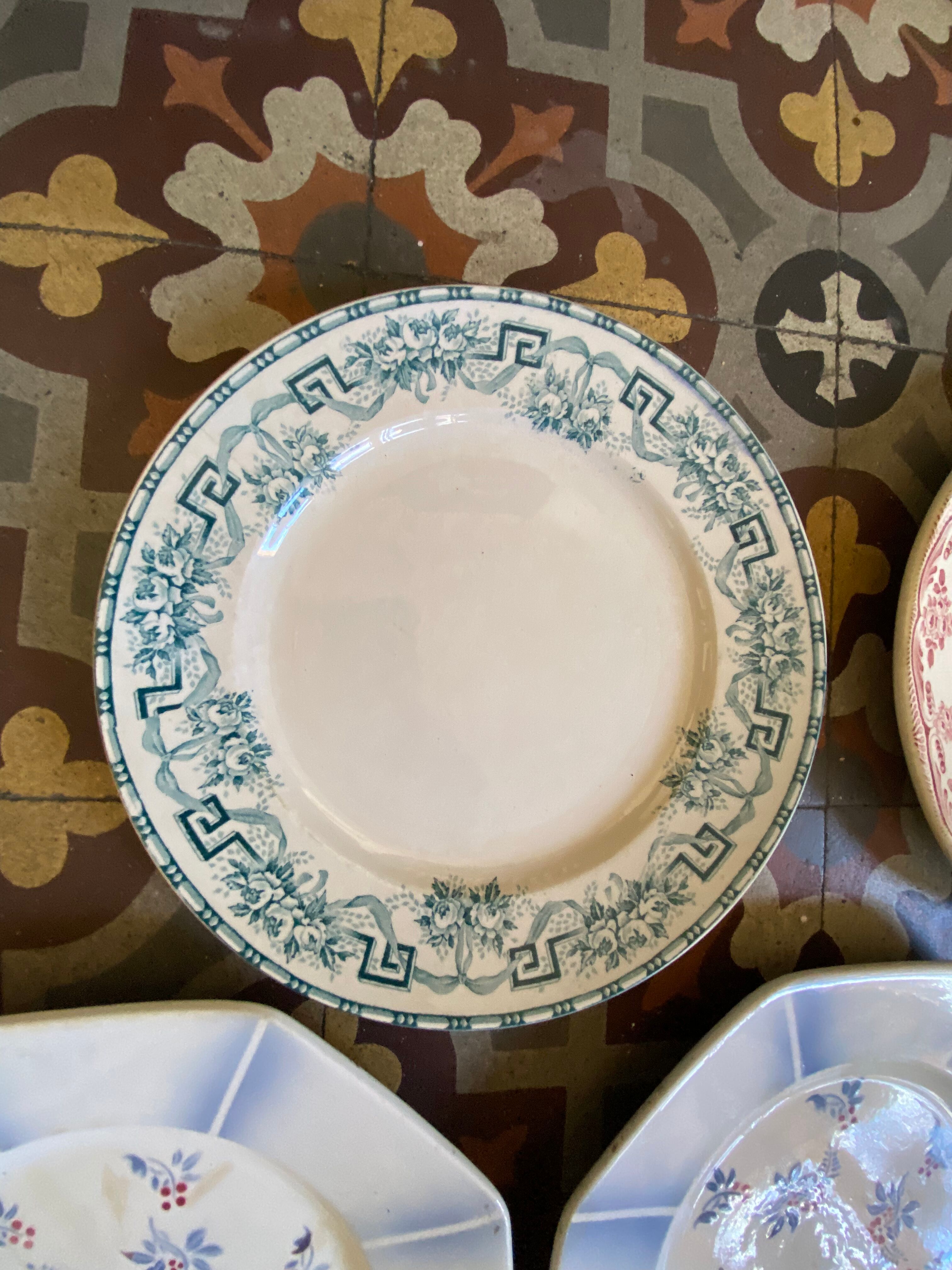 7 matching dessert plates in red green and blue.