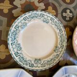 7 matching dessert plates in red green and blue.