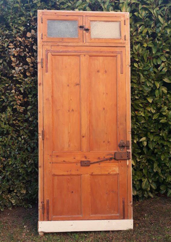 Front door and its frame, translucent glass windows, early 20th century