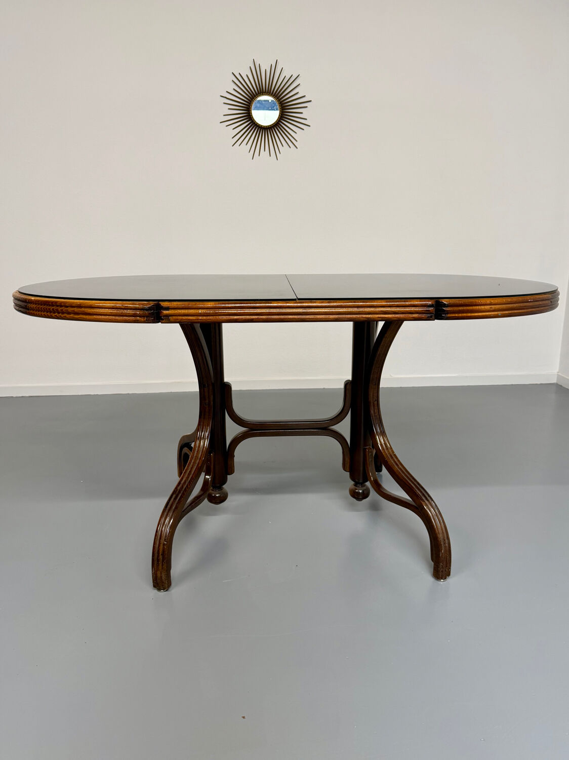Vintage dining table with a cane top by Mundus from the 1970s.