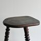 Antique dark wood tripod stool