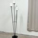 Three-light floor lamp in black lacquered metal, circa 1950.