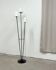 Three-light floor lamp in black lacquered metal, circa 1950.