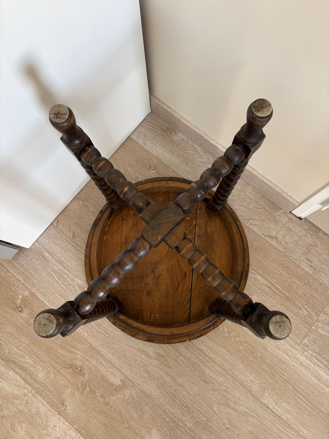 Antique turned wooden side table with authentic charm.