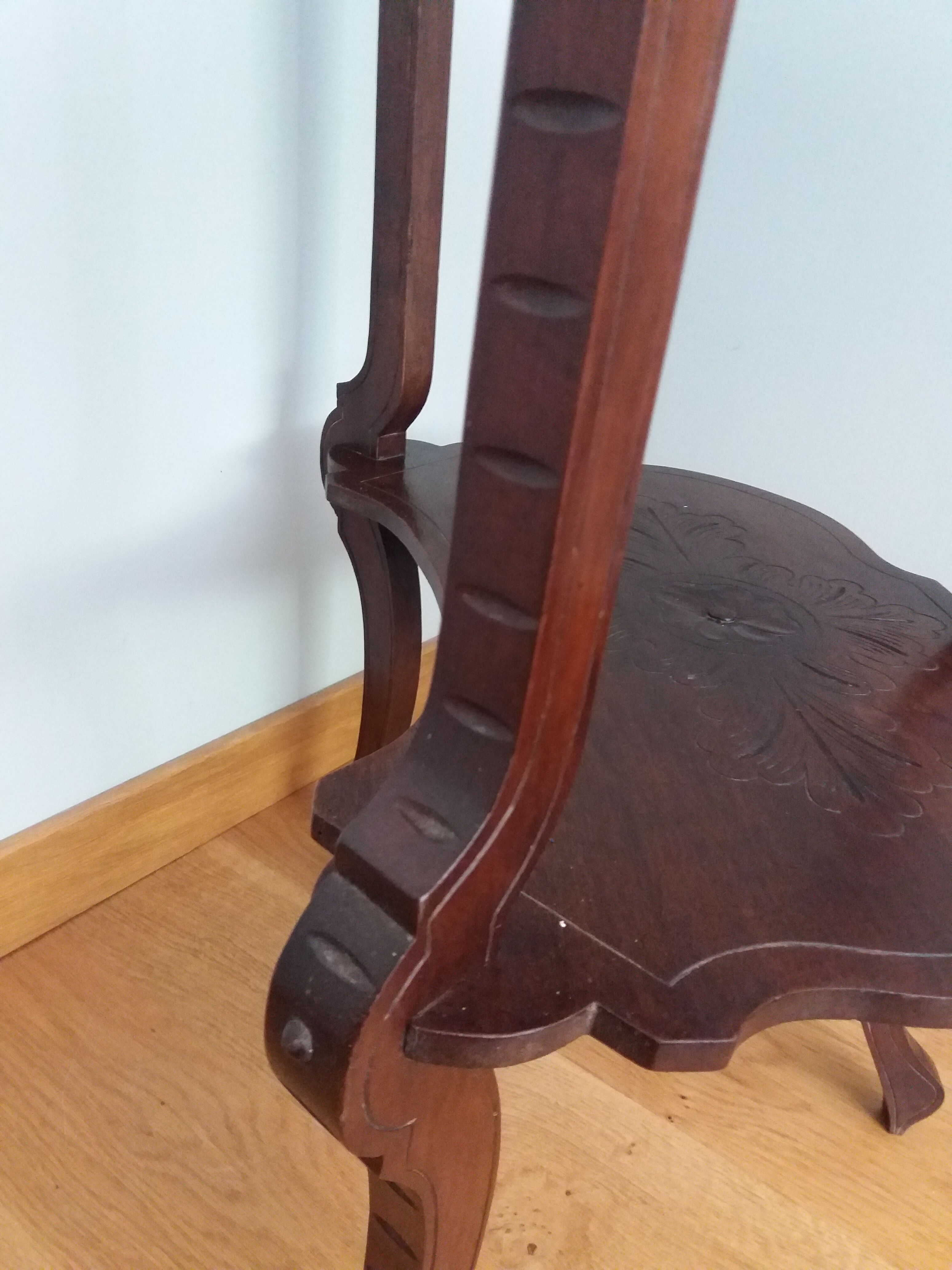 Triplet console harness in carved wood
