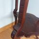 Triplet console harness in carved wood