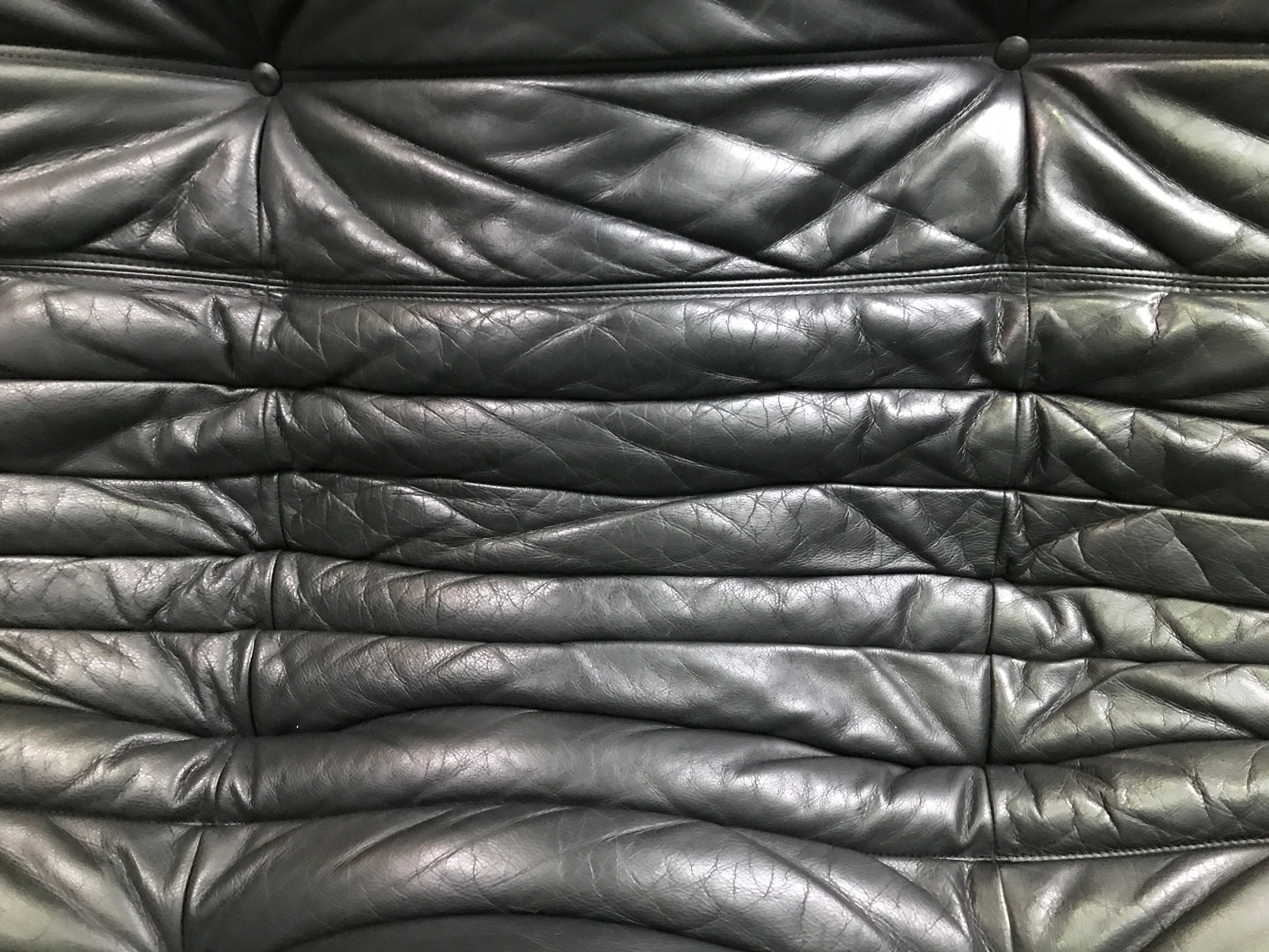 Black leather three seater sofa Togo by Ligne Roset