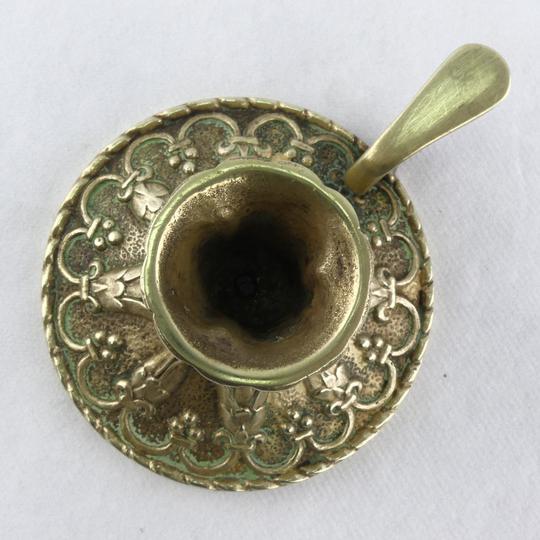 Golden bronze hand-held candlestick