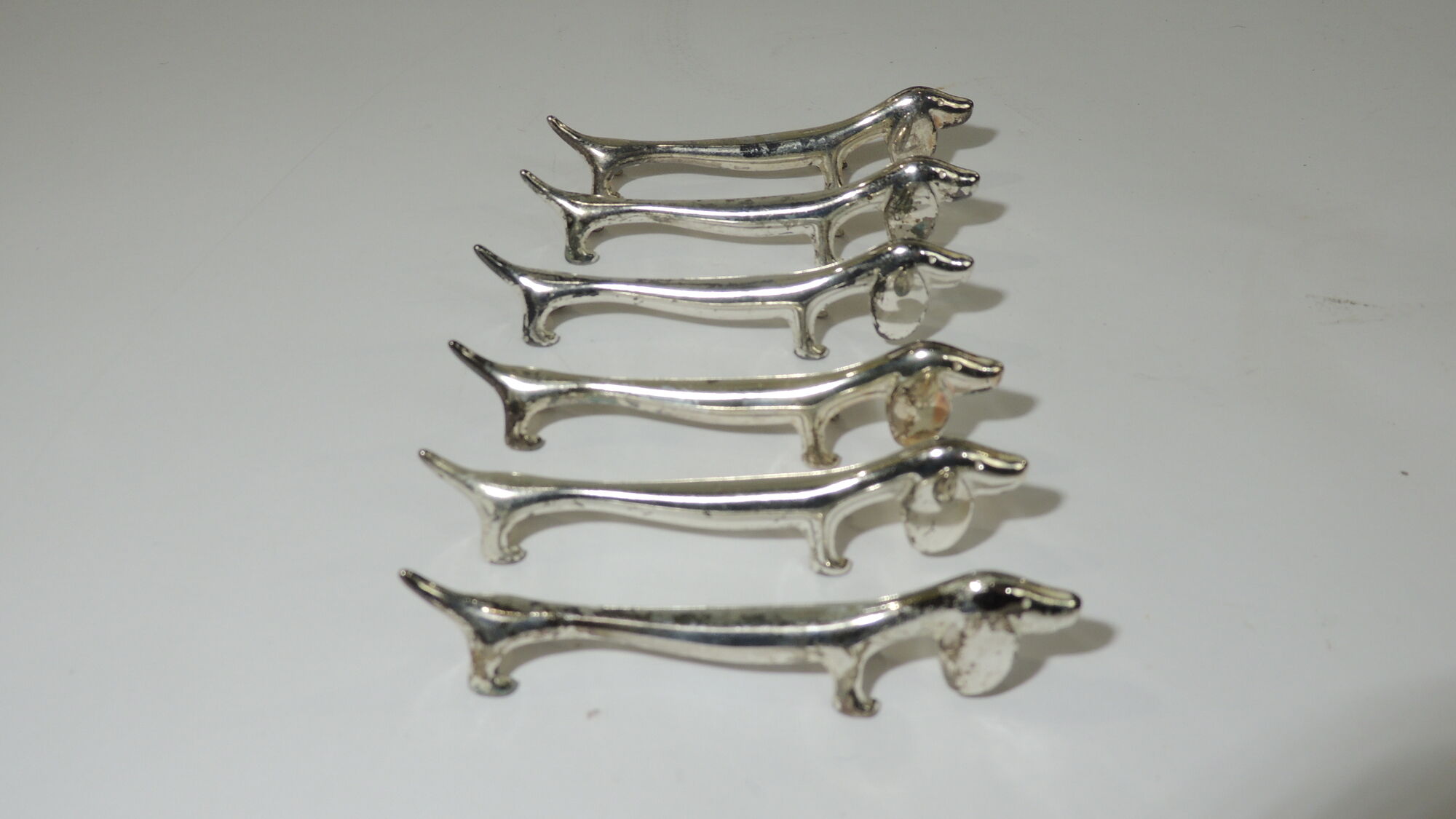 Lot 17 porte couteaux métal /chien /cheveaux/vintage