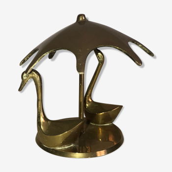 Swan duo under brass umbrella