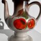 Vintage stoneware teapot with flower and fruit patterns