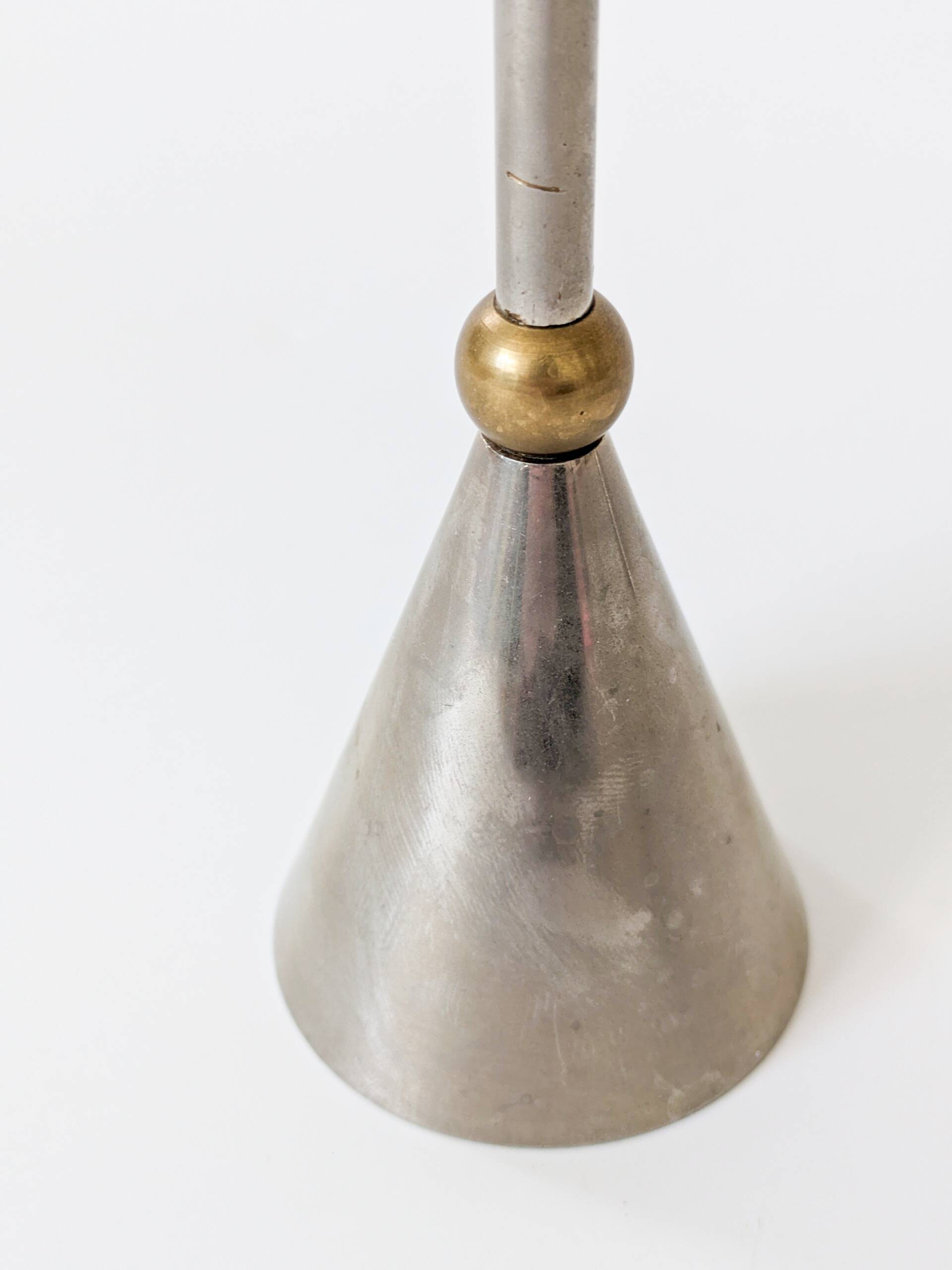 Pair of postmodern candlesticks in Memphis style made of steel and brass.
