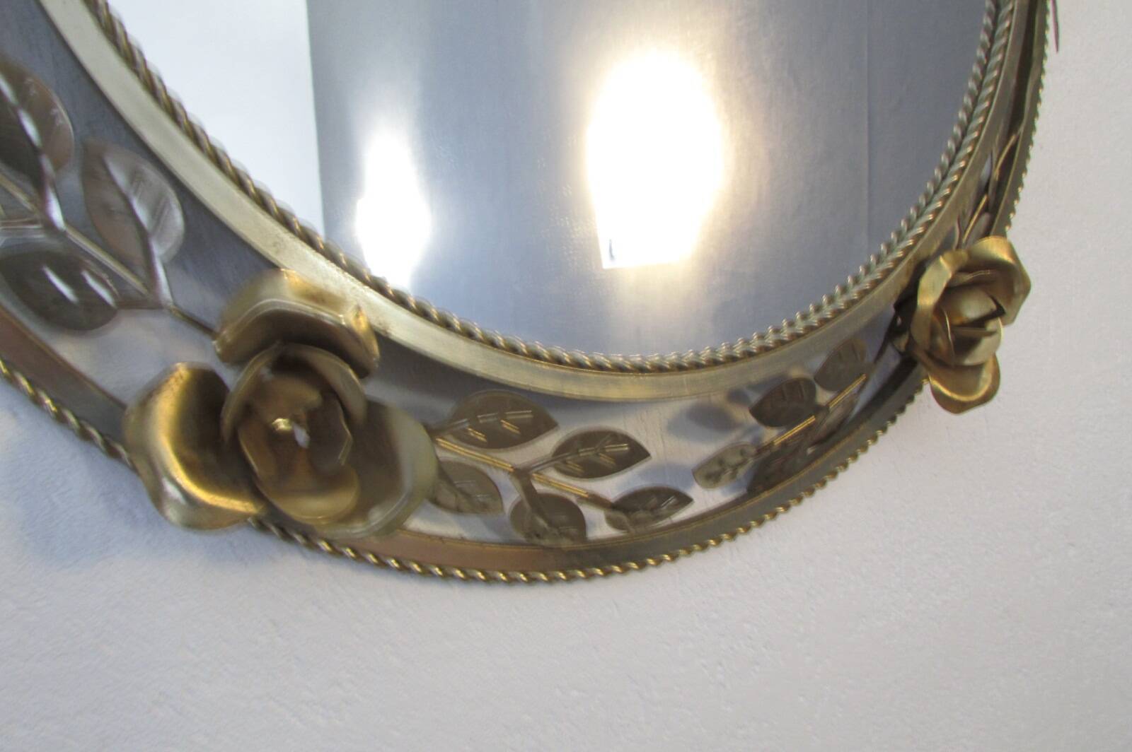 Round gold metal mirror, rose crown
