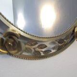 Round gold metal mirror, rose crown